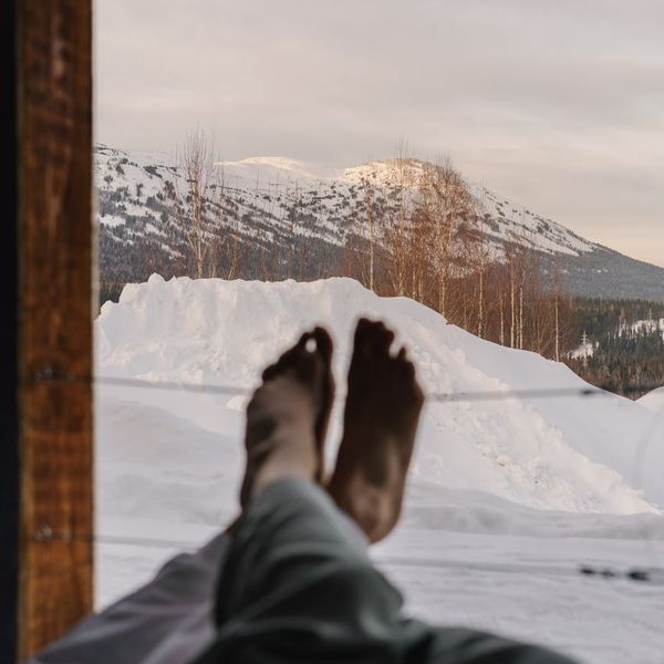 Person meditating at sunrise, feeling energetic and peaceful.